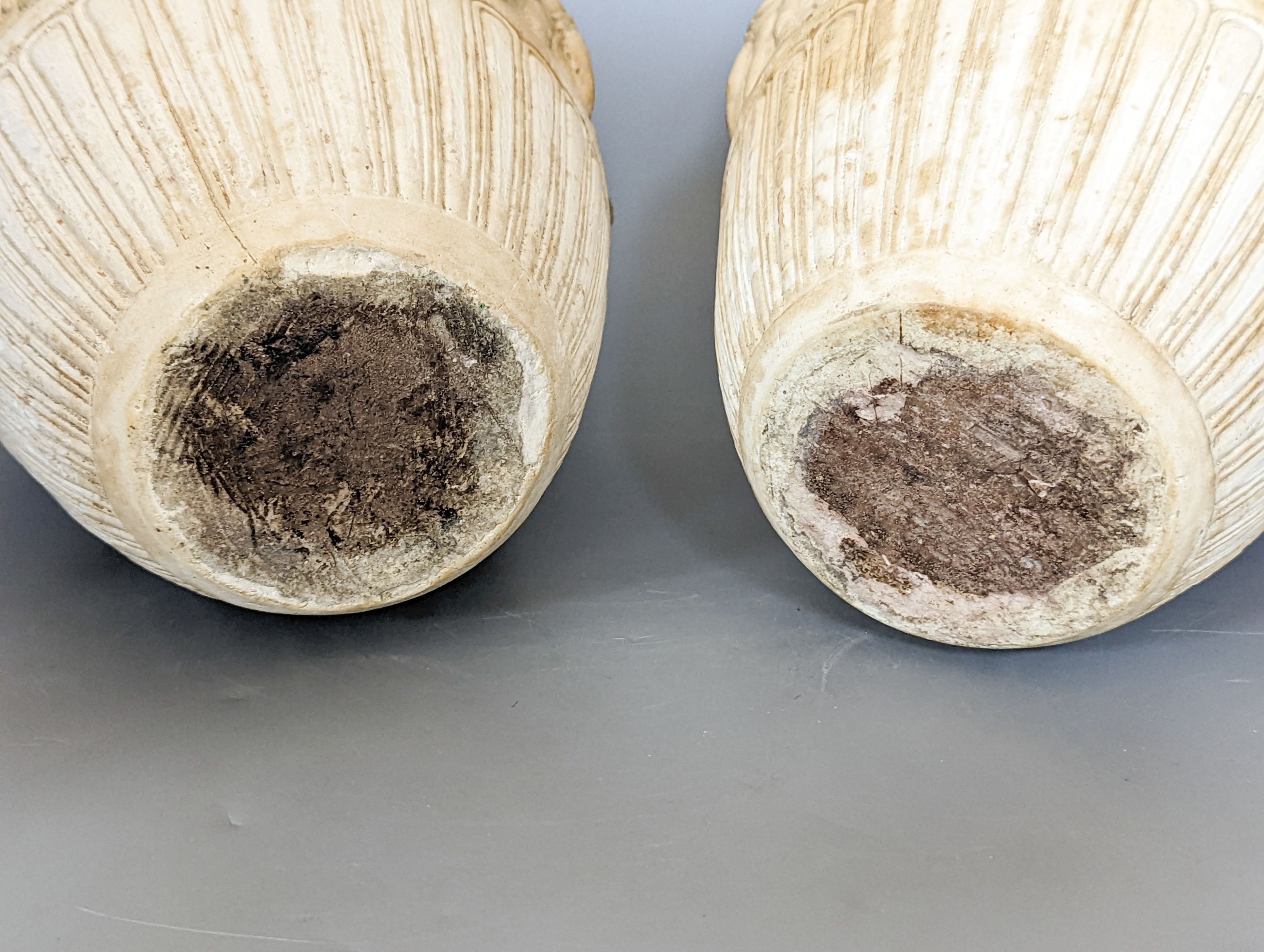 A pair of 19th century earthenware vases moulded in Italian renaissance style 30cm